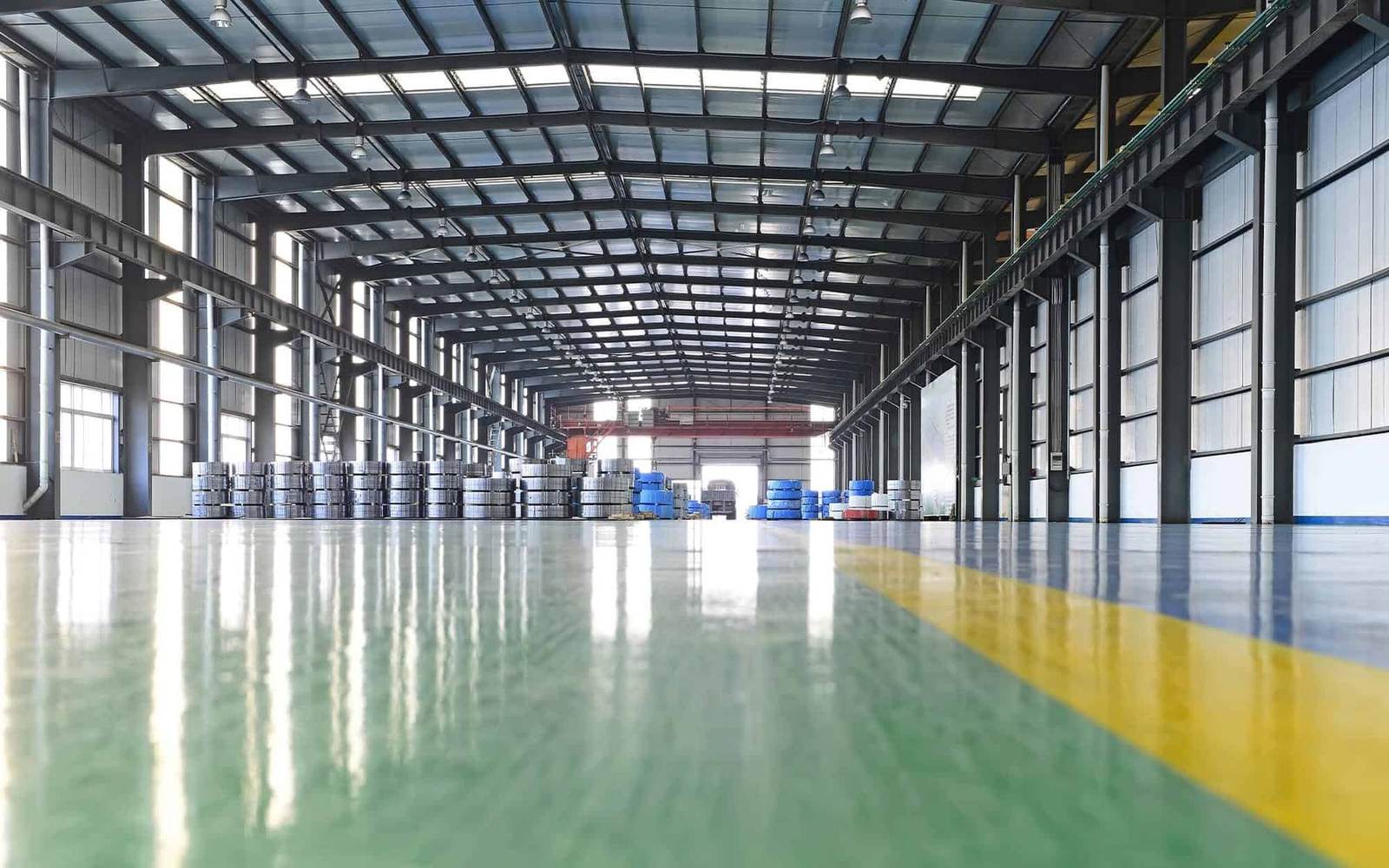 Glossy epoxy warehouse floor installed by Concrete Doctor in Dubai