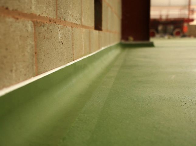 Real PU coving detail — floor curving seamlessly up the wall, installed by Concrete Doctor in Dubai